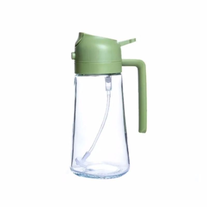Clear glass bottle with green lid and handle on a white background