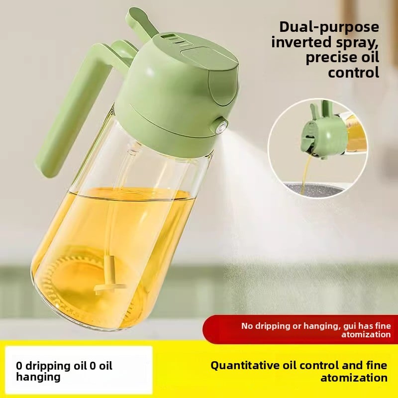 Green oil sprayer with a clear container filled with oil, on a light background.