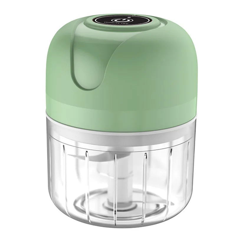 Green handheld food chopper on a white background