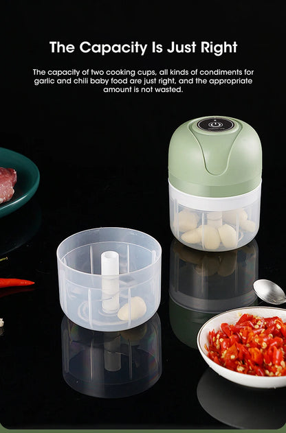 Small kitchen appliance with garlic bulbs on a reflective surface, surrounded by ingredients.