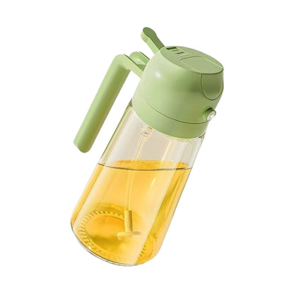 Green and clear bottle containing oil on a white background